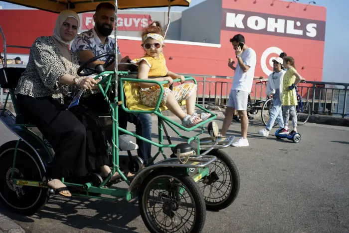 a family in a cycle cart